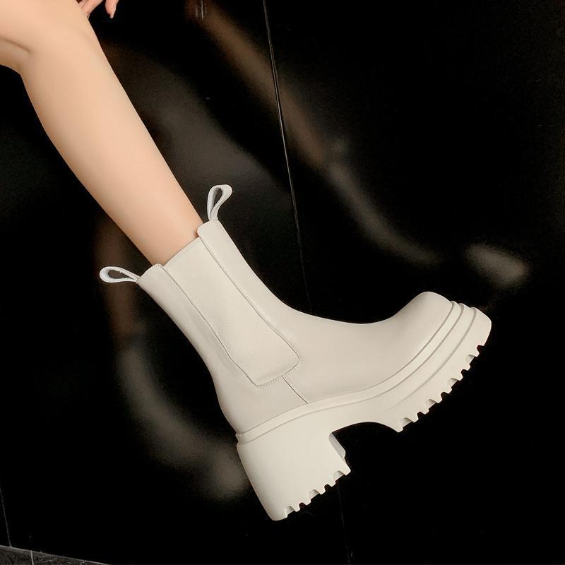 Cream chunky Chelsea boots worn on foot