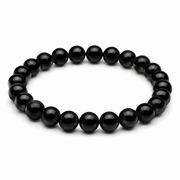 Men’s black onyx bracelet with 10 mm beads on pure white