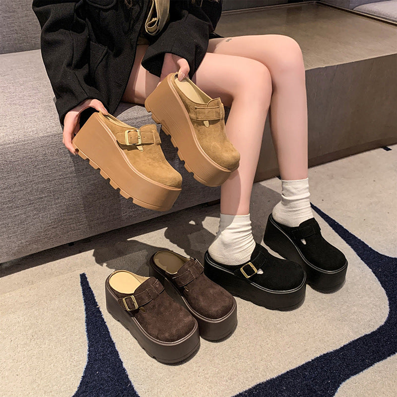 Buckle platform clogs worn in chestnut and black