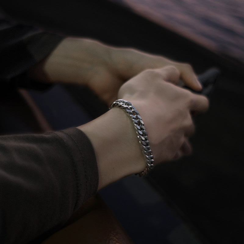 Men wearing the bold titanium-steel curb bracelet