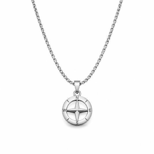 Silver compass cross pendant necklace on white