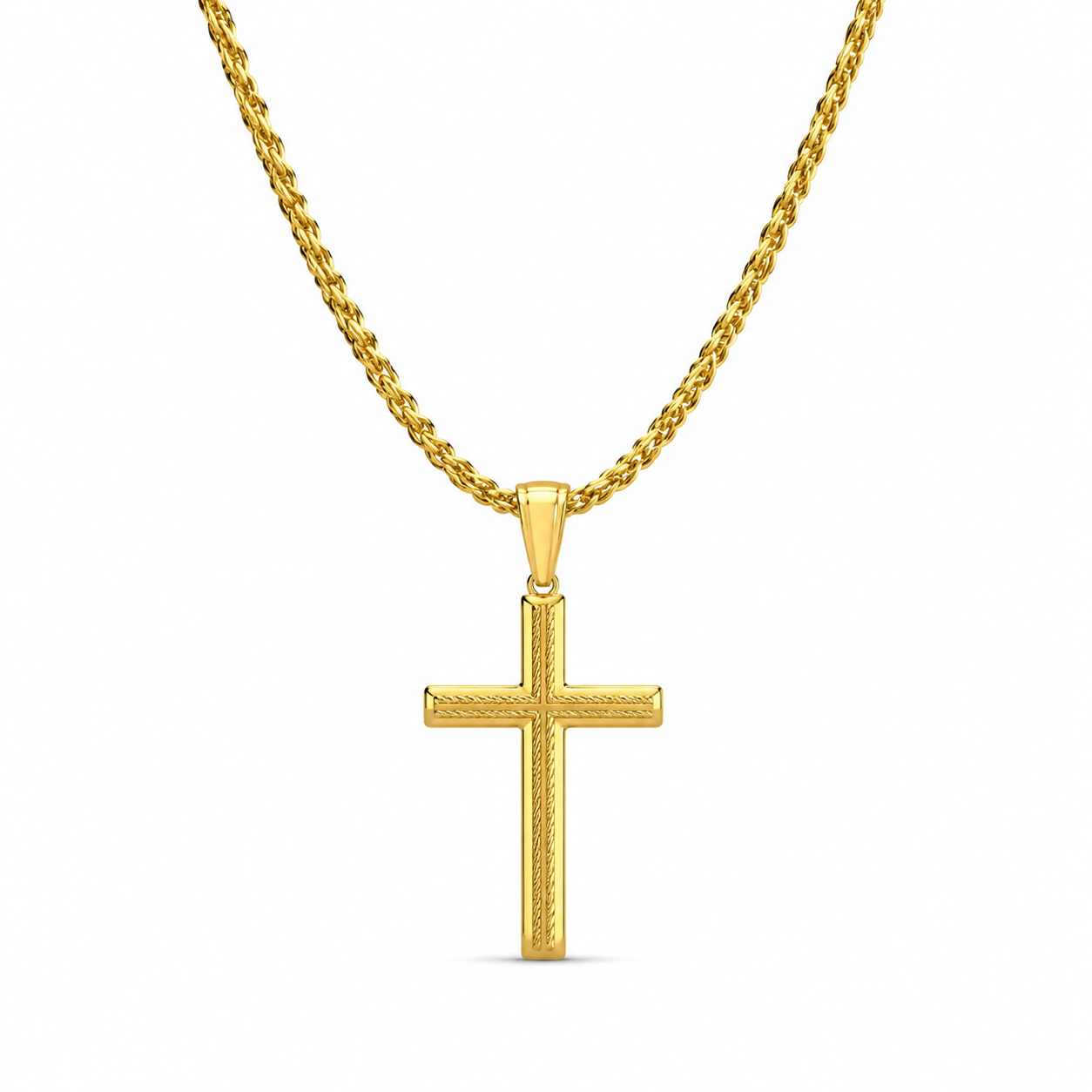 Gold textured cross necklace on white