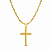 Gold textured cross necklace on white