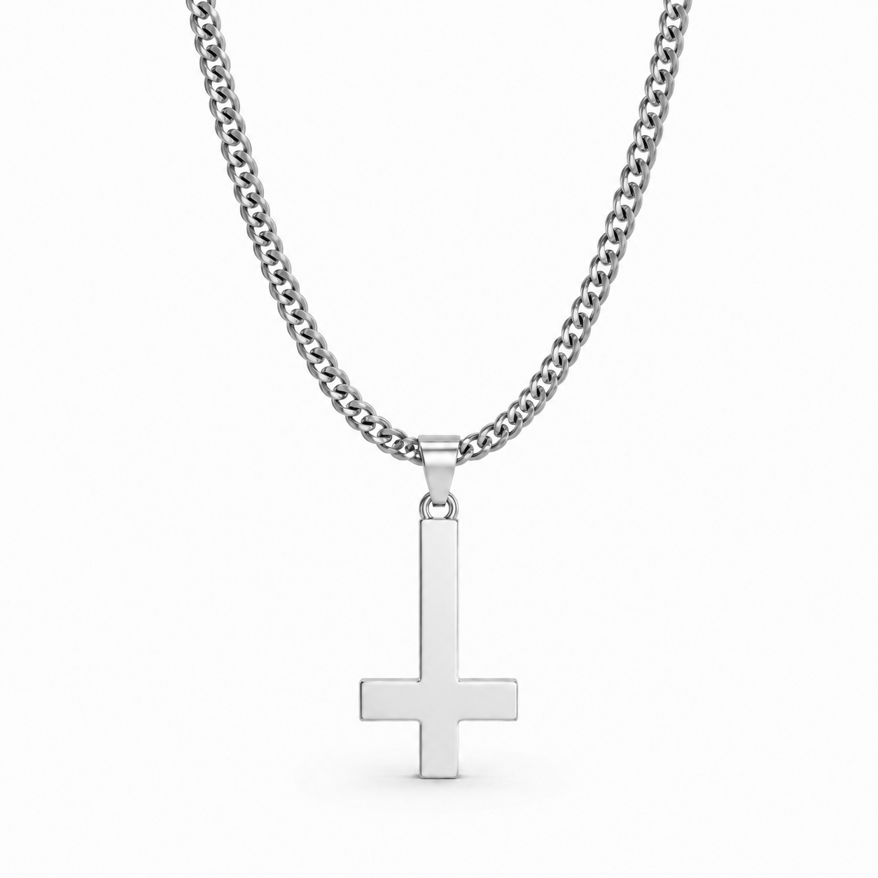 Silver inverted cross necklace on white
