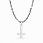 Silver inverted cross necklace on white