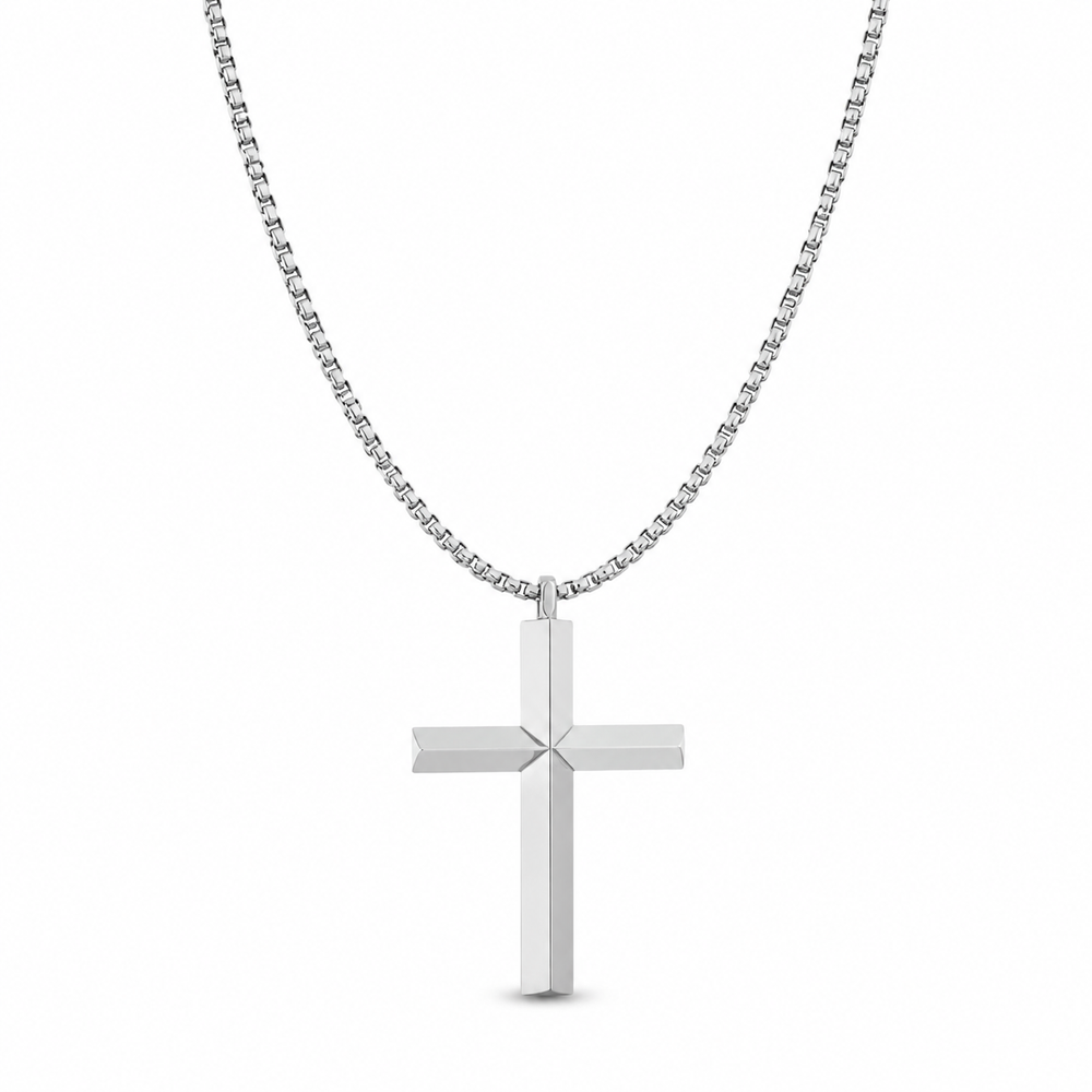 Large silver beveled cross necklace on white