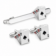 poker cufflink set on white background