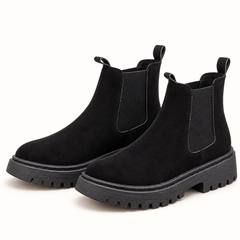 Women's chunky Chelsea boots in black, clear studio view