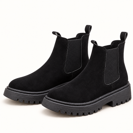 Women's chunky Chelsea boots in black, clear studio view