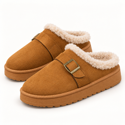 Camel buckle clog slippers with cream faux-fur trim on a clean studio background