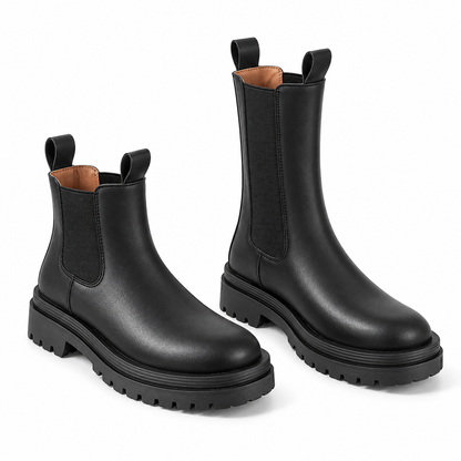 Women's black lug sole Chelsea boots in ankle and tall shaft heights