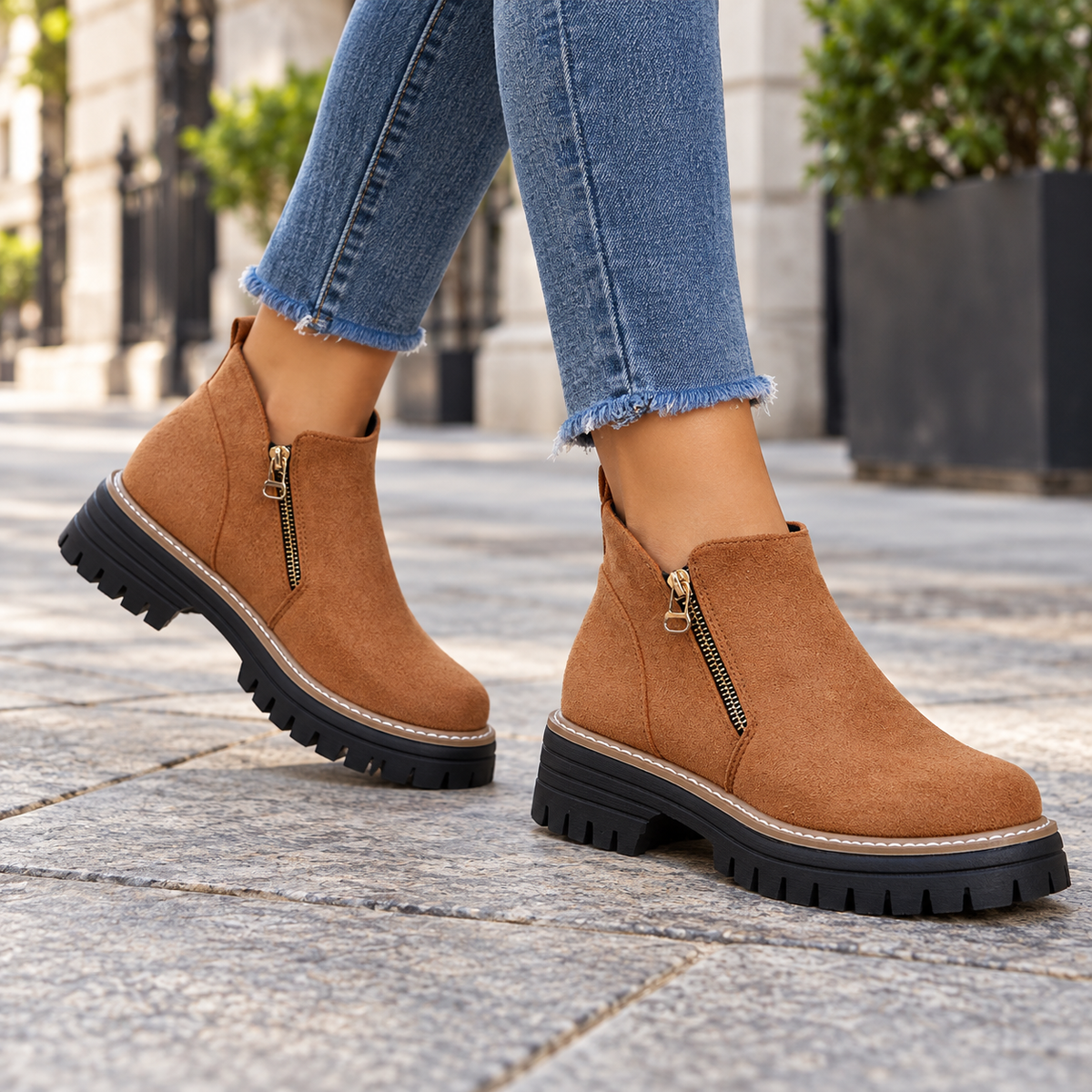 Brown suede-look side-zip ankle boots worn on feet