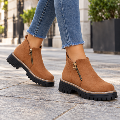 Brown suede-look side-zip ankle boots worn on feet