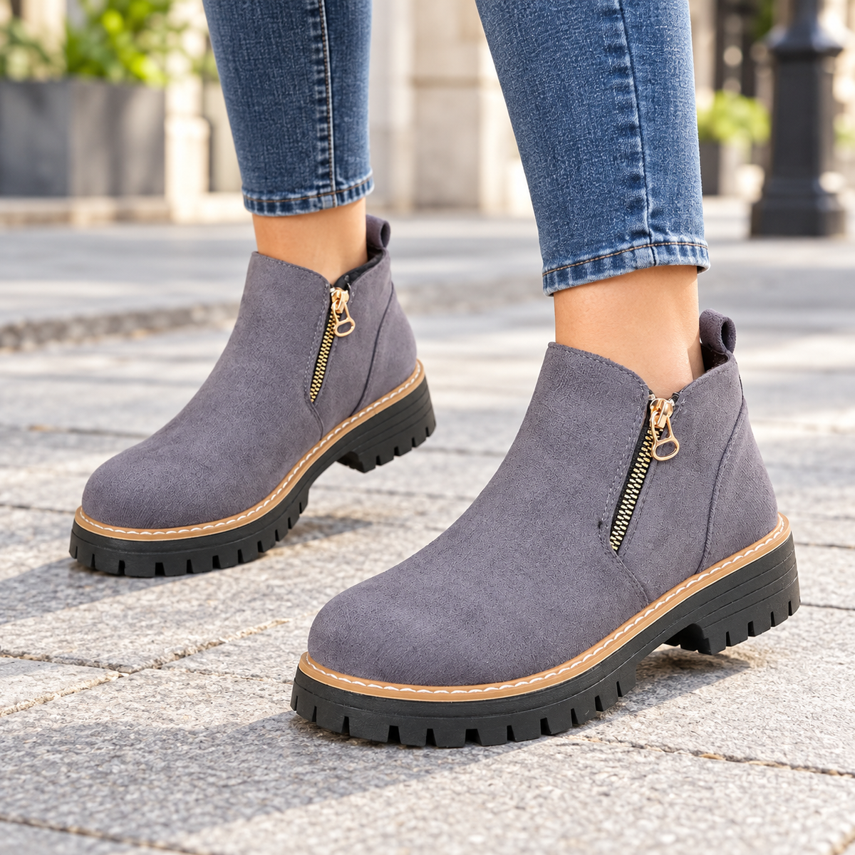 Gray suede-look side-zip ankle boots worn on feet