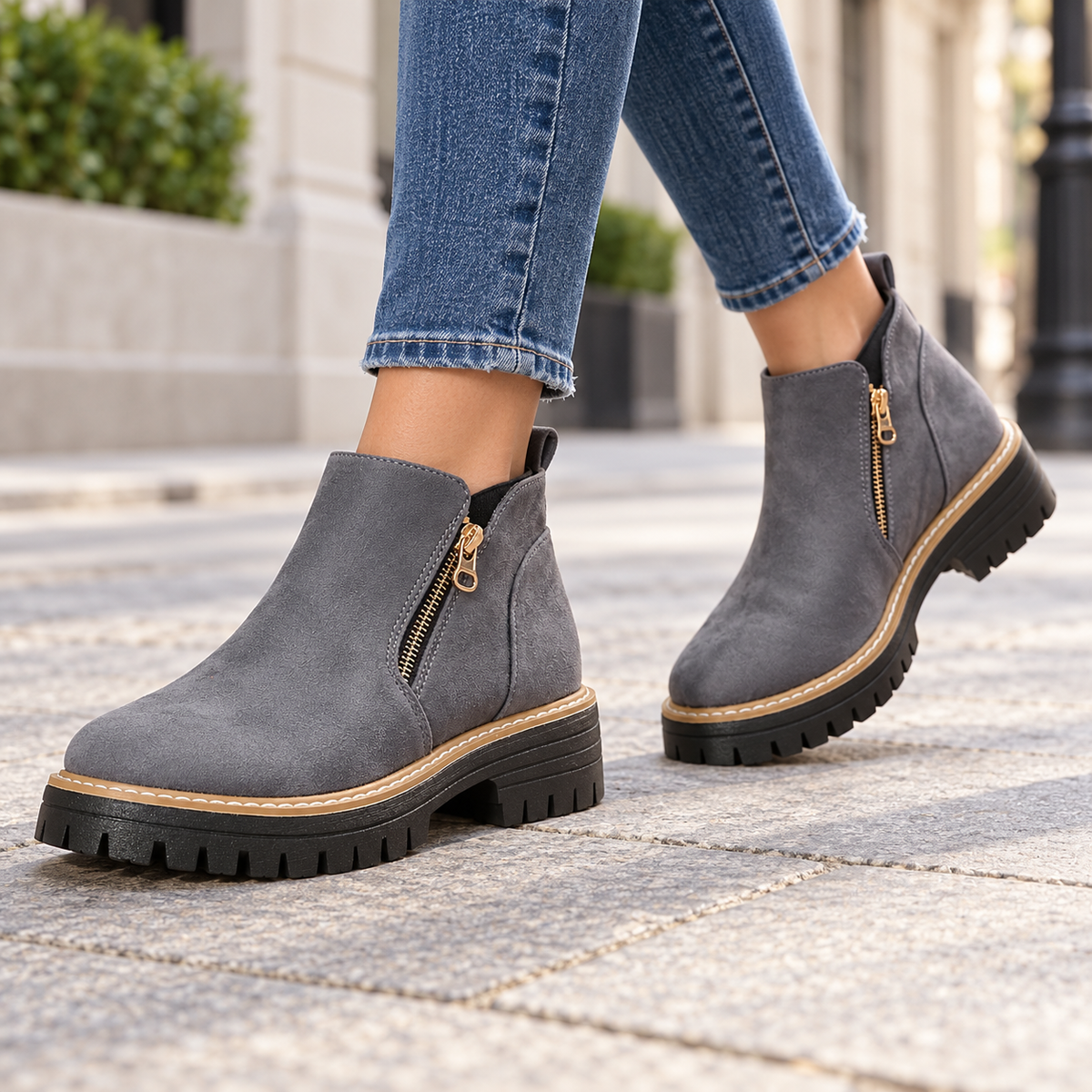 Grey suede-look side-zip ankle boots worn on feet