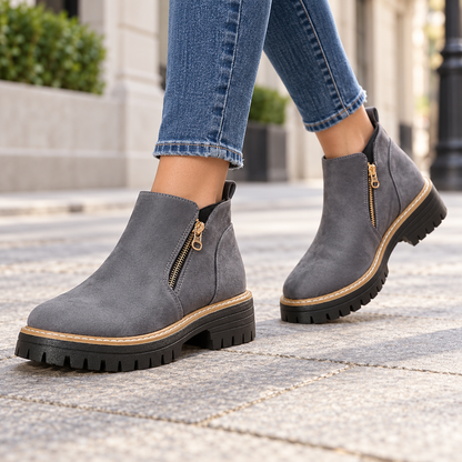 Grey suede-look side-zip ankle boots worn on feet
