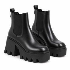Women's black platform heel Chelsea boots on a white background