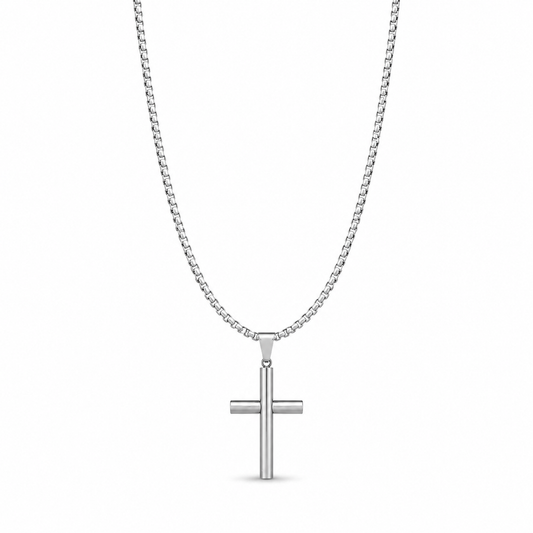 Small silver cylindrical cross necklace on white
