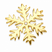 Gold snowflake brooch on white