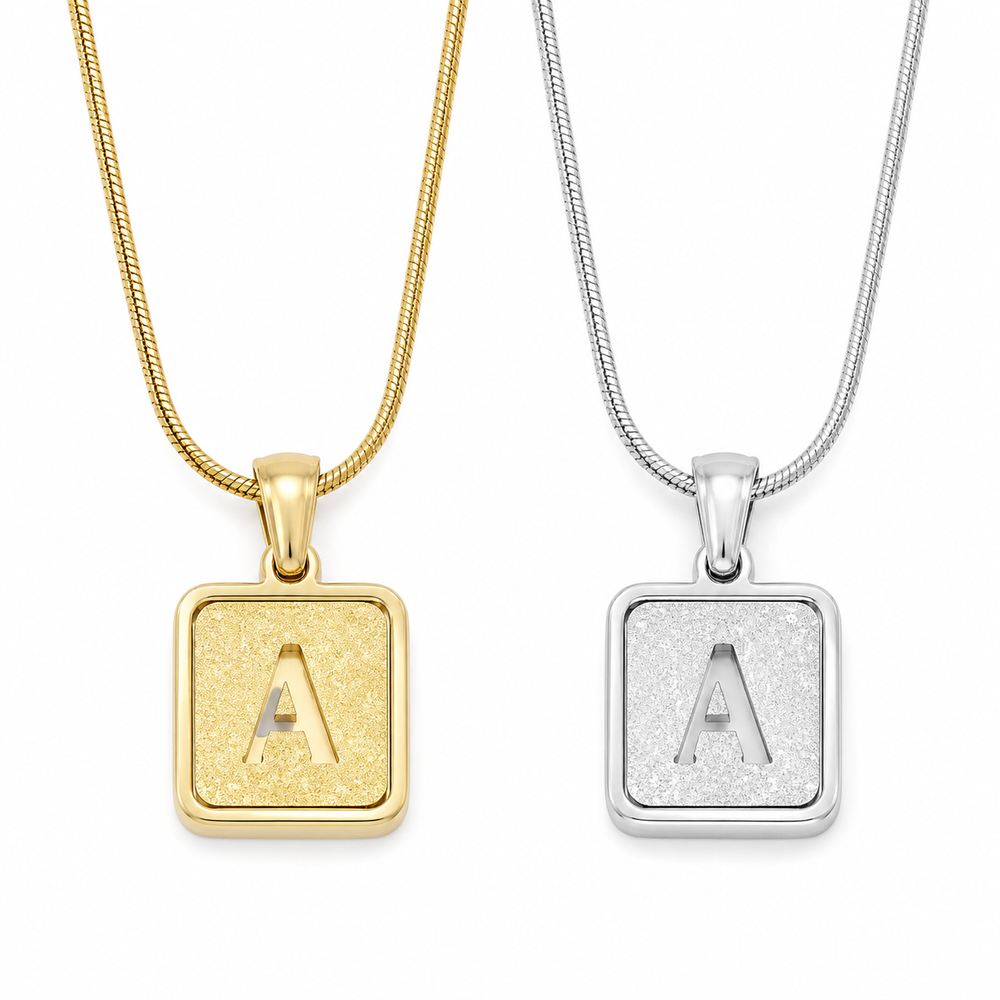 square initial necklace on white background