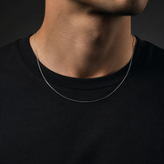 Man wearing a fine silver-tone 0.9mm square snake chain