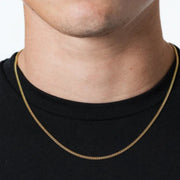 Man wearing a 3mm gold-tone Cuban chain