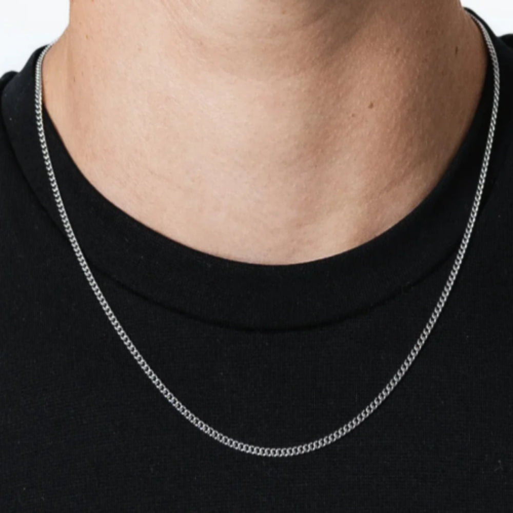 Man wearing a 3mm silver-tone Cuban chain