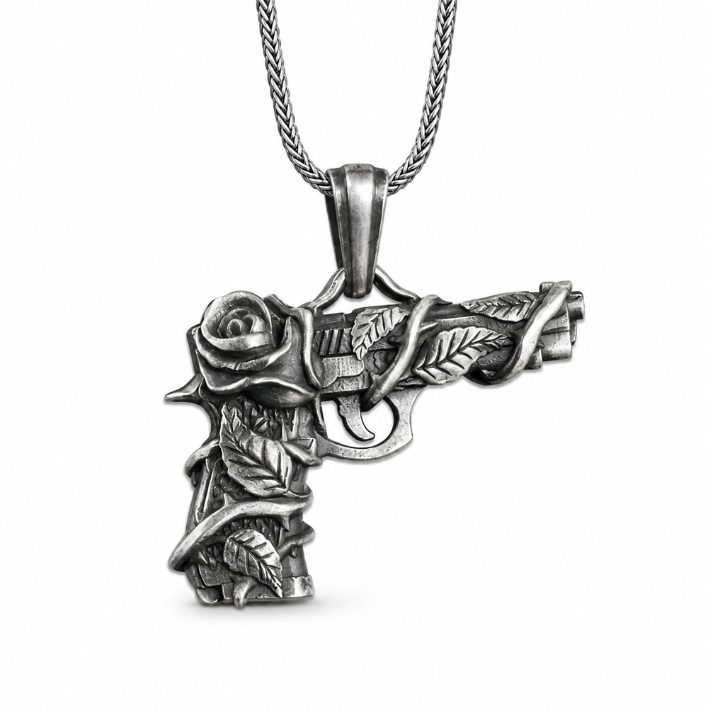 Antique Gun and Rose Pendant Necklace on pure white background