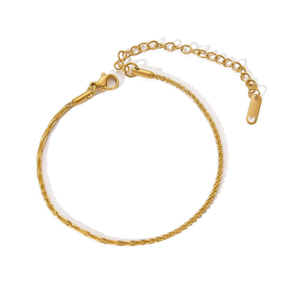 VALT fine gold twist chain bracelet on white background