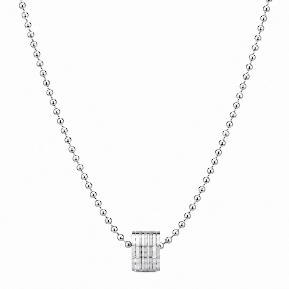Silver-tone barrel pendant necklace on white