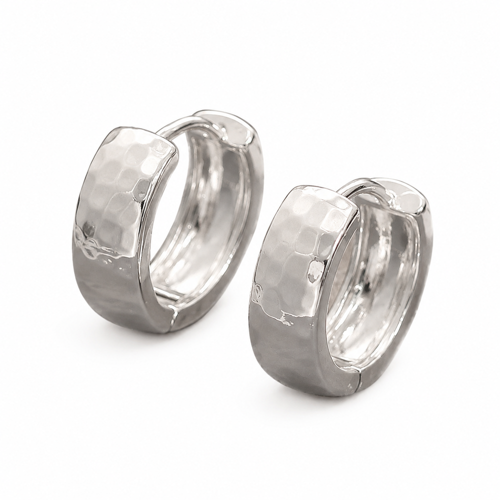 Textured Stainless Steel Huggie Earrings on pure white background
